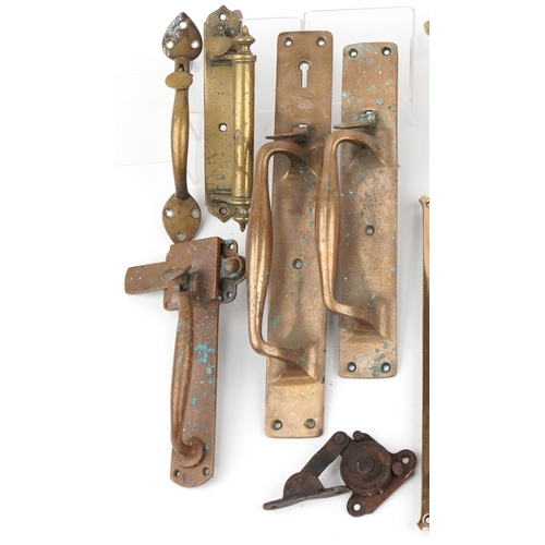 148 - Arts & Crafts metalware including doorplates, ceiling light fittings and window catches, the largest... 