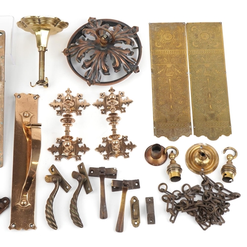 148 - Arts & Crafts metalware including doorplates, ceiling light fittings and window catches, the largest... 