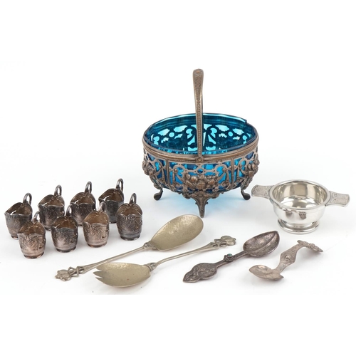 501 - Assorted Arts & Crafts metalware including spoons, liqueurs holders, quaich and silver plated fruit ... 