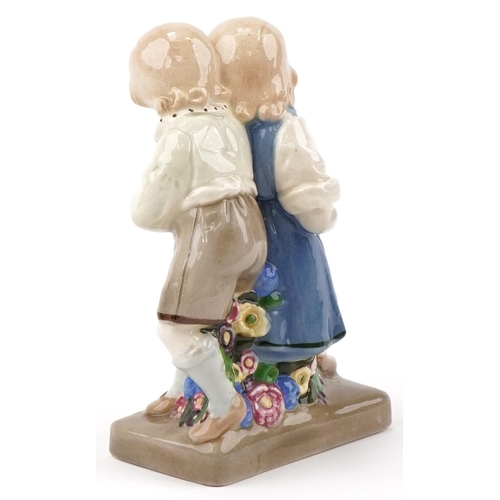 476 - Austrian Secessionist model of boy and girl numbered 10344 to the base, 16cm high