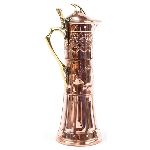 486 - WMF Arts & Crafts copper claret jug with stylized decoration, 40cm high