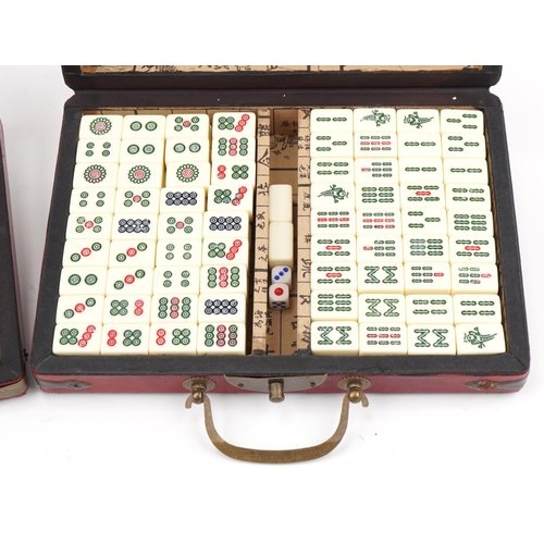 2182 - Chinese Mahjong game and astrological compass, each housed in a red lacquer fitted case, the largest... 