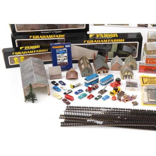 2343 - Large collection of N gauge model railway trackside accessories including buildings, figures and ani... 