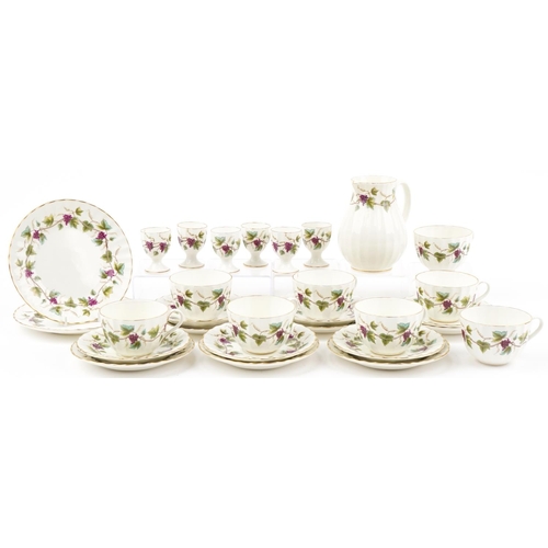 2134 - Royal Worcester Bacchanal teaware including milk jug, trios and eggcups, the jug 14cm high