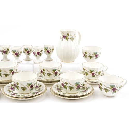 2134 - Royal Worcester Bacchanal teaware including milk jug, trios and eggcups, the jug 14cm high