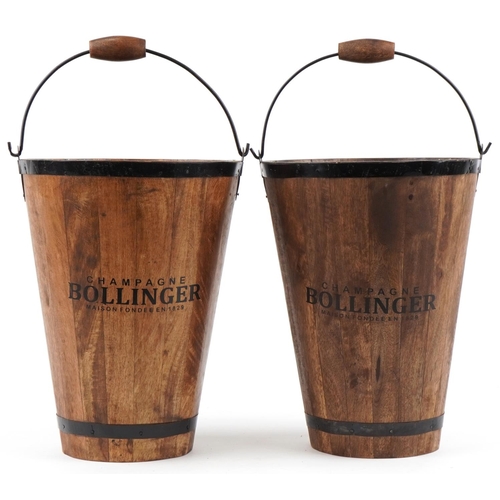 2252 - Pair of Bollinger Champagne hardwood ice buckets with metal mounts and swing handles, 40cm high excl... 