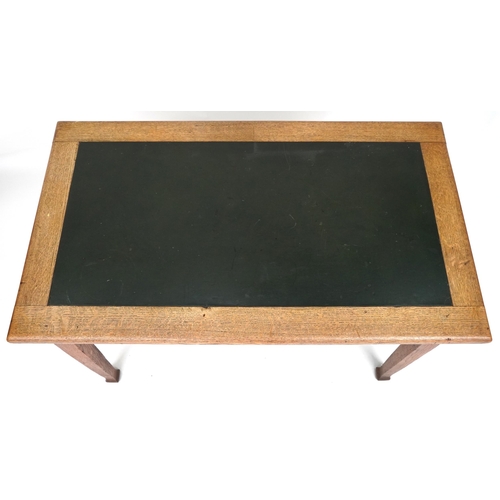 634 - Edwardian Arts & Crafts writing table, the top inset with a green leatherette writing surface, 75cm ... 