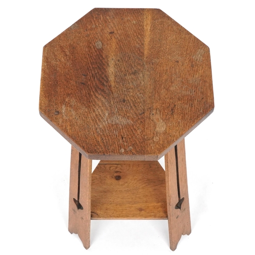 594 - Early 20th century Arts & Crafts oak octagonal lamp table, possibly Glasgow School, with pierced sup... 