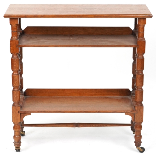 558 - Early 20th century Arts & Crafts oak three tier library book stand retailed by Liberty's of London, ... 