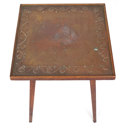 589 - Edwardian Arts & Crafts square oak occasional table, the top inset with an embossed copper panel, 65... 