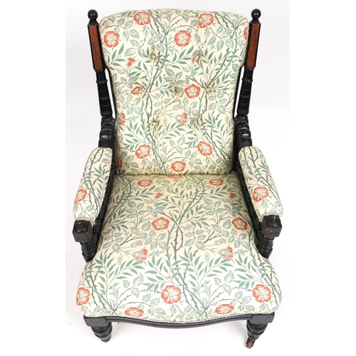 686 - Late Victorian walnut and ebonised gentleman's salon armchair upholstered in floral fabric, 96cm H x... 