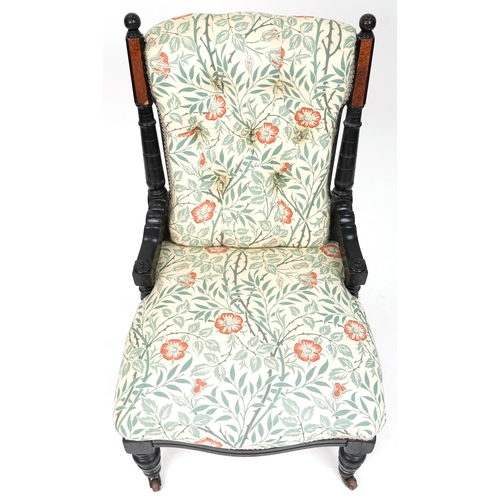 685 - Late Victorian walnut and ebonised ladies salon armchair upholstered in floral fabric, 88cm H x 56cm... 