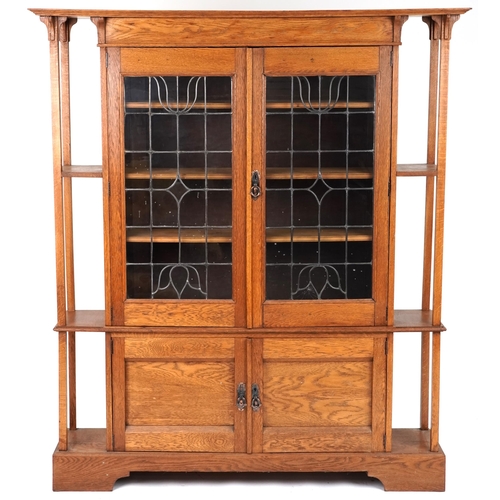 537 - Edwardian Arts & Crafts oak side cabinet with leaded glazed doors, 183cm H x 153cm W x 35cm D