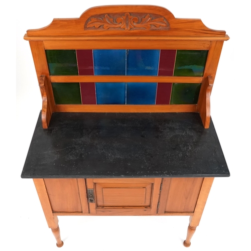 560 - Early 20th century walnut washstand with a tiled shelf back and black marble top, 128cm H x 92cm W x... 