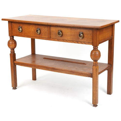 574 - 20th century Arts & Crafts style oak side table fitted with two drawers, 86cm H x 122cm W x 53cm D