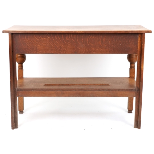 574 - 20th century Arts & Crafts style oak side table fitted with two drawers, 86cm H x 122cm W x 53cm D