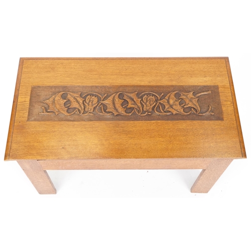 557 - Early 20th century Arts & Crafts oak hall bench with carved top panel and pierced decoration, 51cm H... 