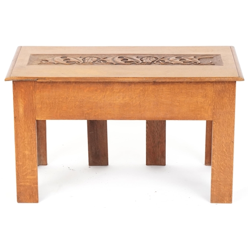 557 - Early 20th century Arts & Crafts oak hall bench with carved top panel and pierced decoration, 51cm H... 