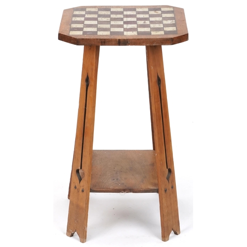 572 - Early 20th century Arts & Crafts oak two tier occasional table with later painted chequer board top,... 