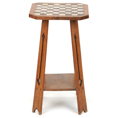 572 - Early 20th century Arts & Crafts oak two tier occasional table with later painted chequer board top,... 