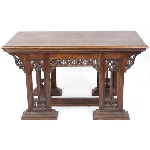 551 - Late Victorian Gothic Revival oak centre table, 80cm H x 144cm W x 75cm D