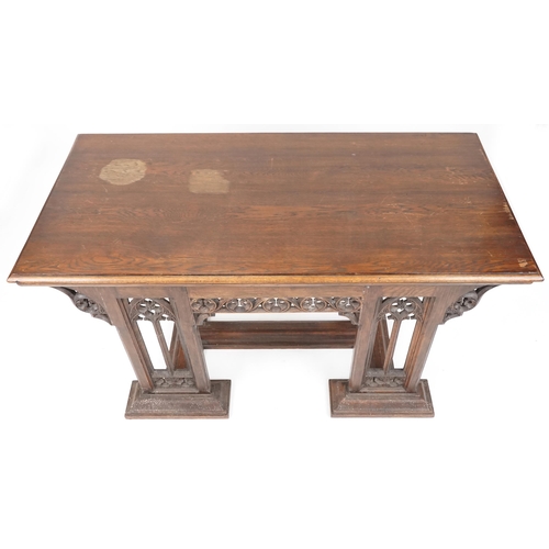 551 - Late Victorian Gothic Revival oak centre table, 80cm H x 144cm W x 75cm D