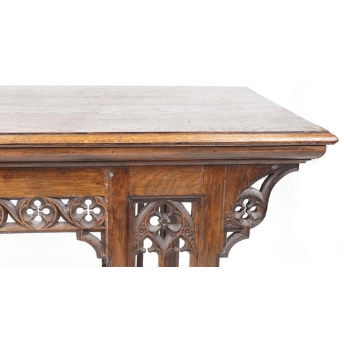 551 - Late Victorian Gothic Revival oak centre table, 80cm H x 144cm W x 75cm D