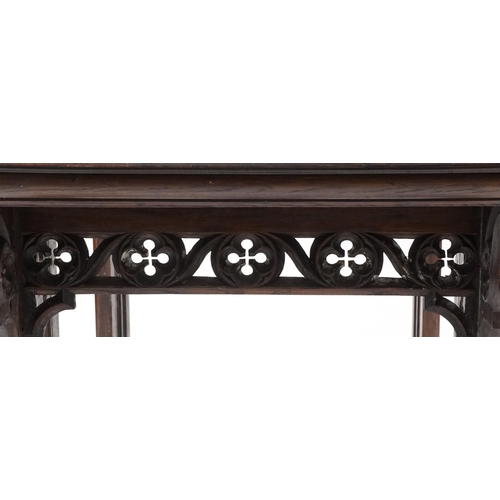 551 - Late Victorian Gothic Revival oak centre table, 80cm H x 144cm W x 75cm D