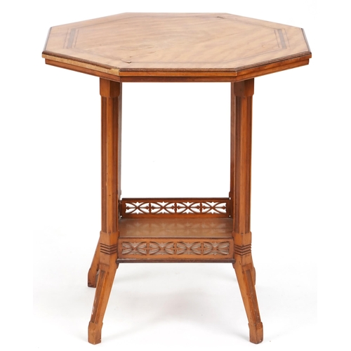 676 - Edwardian satinwood octagonal two tier occasional table, 63cm high x 56cm in diameter