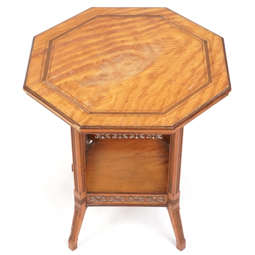 676 - Edwardian satinwood octagonal two tier occasional table, 63cm high x 56cm in diameter