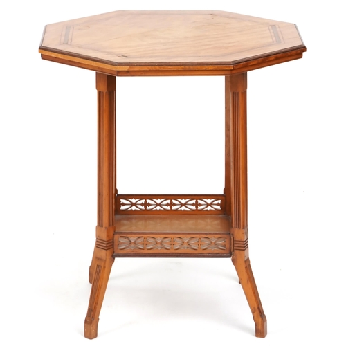 676 - Edwardian satinwood octagonal two tier occasional table, 63cm high x 56cm in diameter