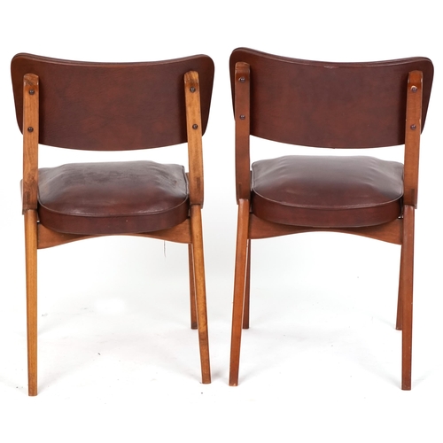 711 - Centa, two of Danish mid century teak chairs with brown faux leather upholstery, 80cm high