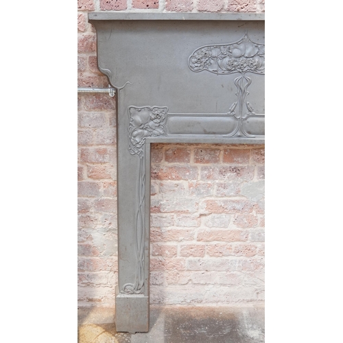 646 - Art Nouveau cast iron fire surround cast with stylized flowers, registration mark to the reverse, 13... 