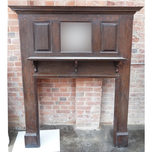 650 - Arts & Crafts oak fire surround with bevelled mirror back, 183cm high x 145cm wide