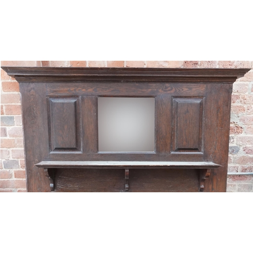 650 - Arts & Crafts oak fire surround with bevelled mirror back, 183cm high x 145cm wide