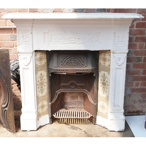 648 - Cast iron fire place and surround, 125cm high x 128cm wide