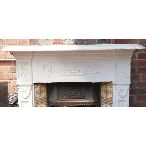 648 - Cast iron fire place and surround, 125cm high x 128cm wide