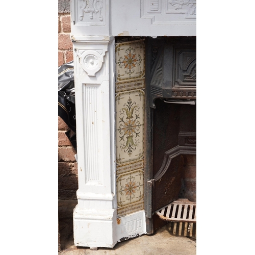 648 - Cast iron fire place and surround, 125cm high x 128cm wide