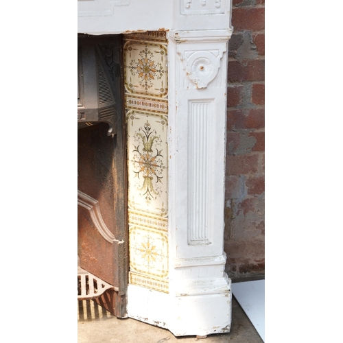 648 - Cast iron fire place and surround, 125cm high x 128cm wide