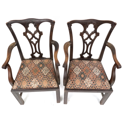 661 - Pair of late 19th/early 20th century mahogany framed scroll arm carver chairs with carved decoration... 