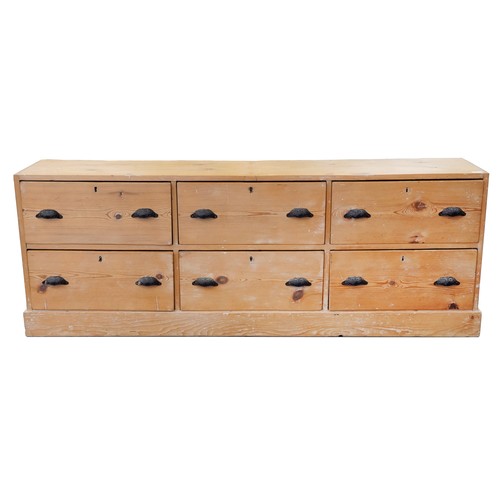 731 - Early 20th century pine bank of six drawers, (alterations) 67cm H x 186cm W x 38cm D