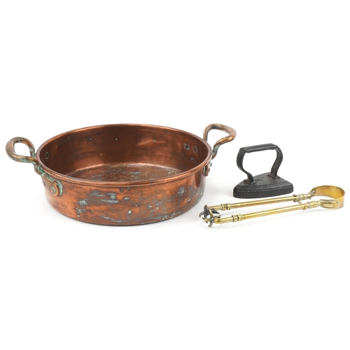 2207 - Victorian copper preserve pan with brass handles, cast iron smoothing iron and pair of brass claw sh... 