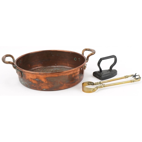 2207 - Victorian copper preserve pan with brass handles, cast iron smoothing iron and pair of brass claw sh... 