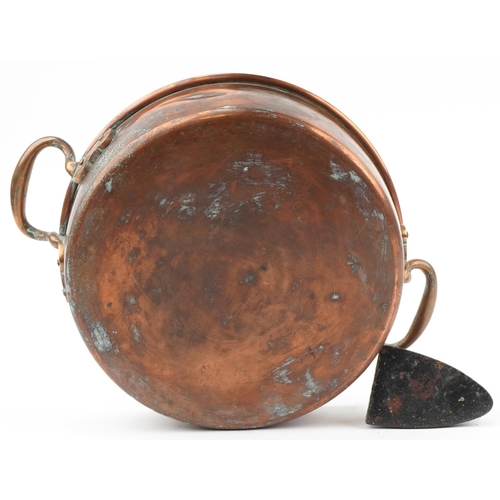 2207 - Victorian copper preserve pan with brass handles, cast iron smoothing iron and pair of brass claw sh... 