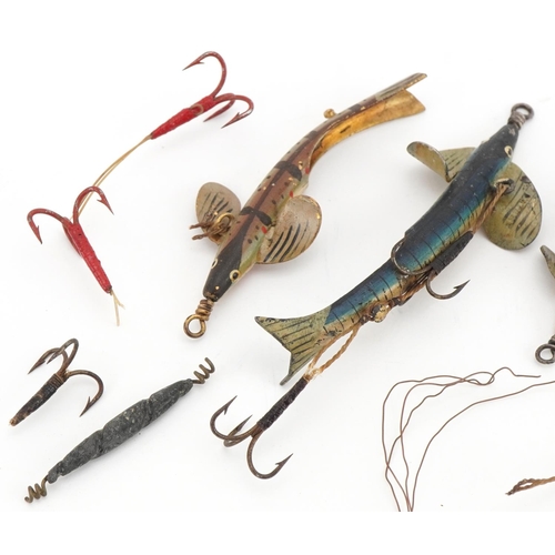 1410 - Four hand painted metal fishing lures, the largest 8cm in length