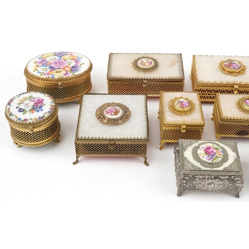 2213 - Collection of gilt metal and pewter jewel boxes, some musical and some inset with porcelain panels, ... 