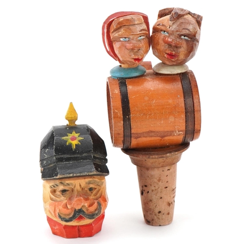 2277 - Five novelty moving carved wood figural bottle stops and corkscrew, the largest 15cm high