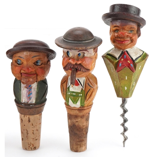 2277 - Five novelty moving carved wood figural bottle stops and corkscrew, the largest 15cm high