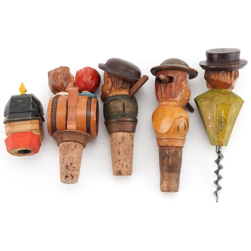 2277 - Five novelty moving carved wood figural bottle stops and corkscrew, the largest 15cm high