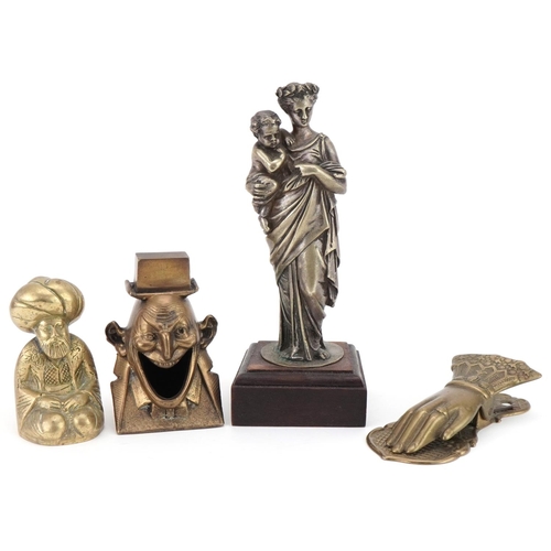 1169 - Metalware including a Victorian style letter clip in the form of a hand, silvered figure of a mother... 